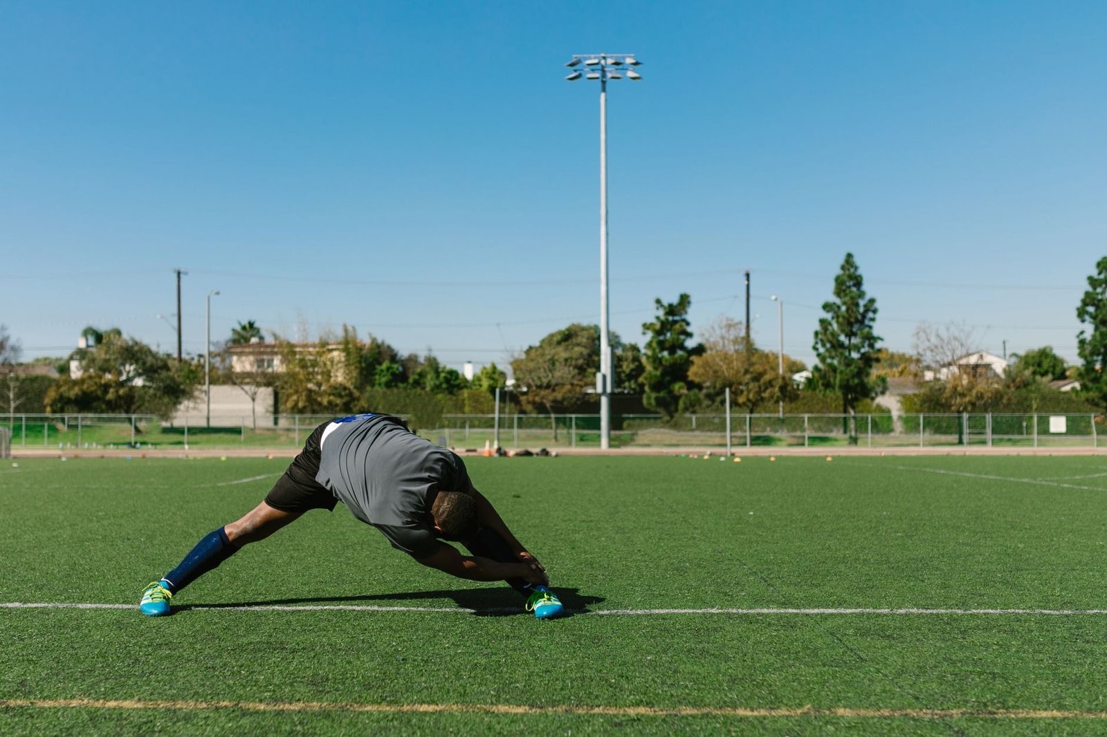 man doing leg stretches
